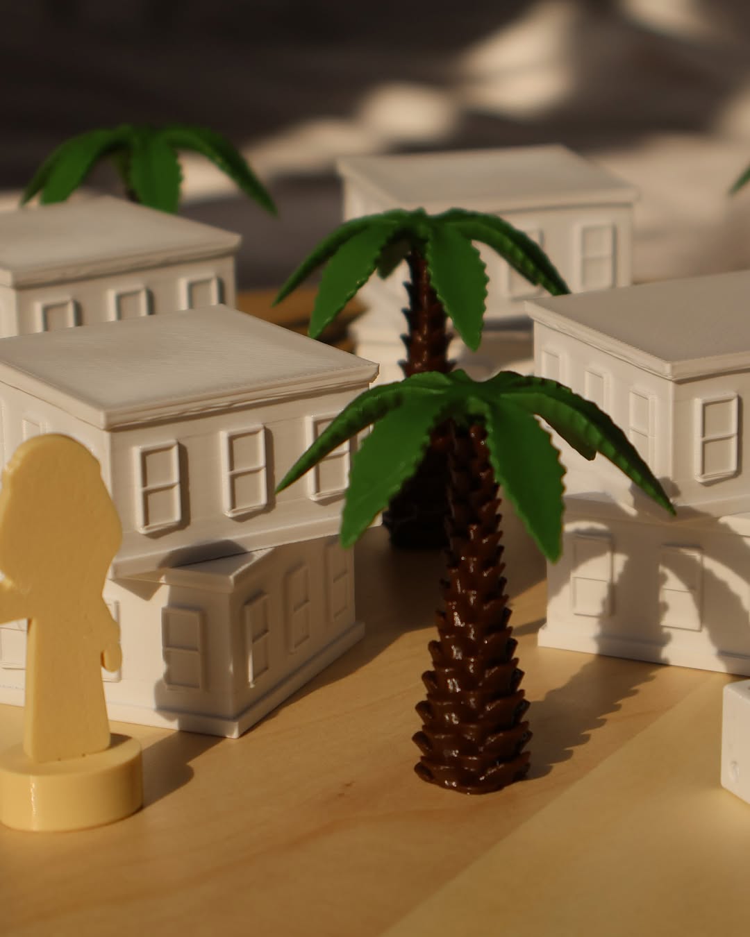 3D printed miniature buildings and palm trees for a school architecture project